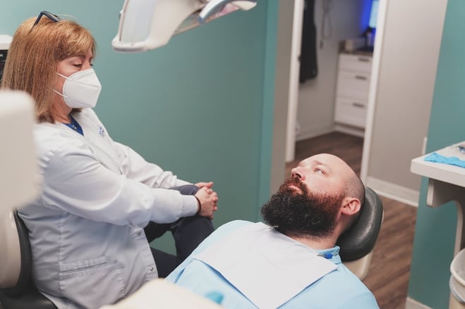 Dentist talking to patient about insurance benefits