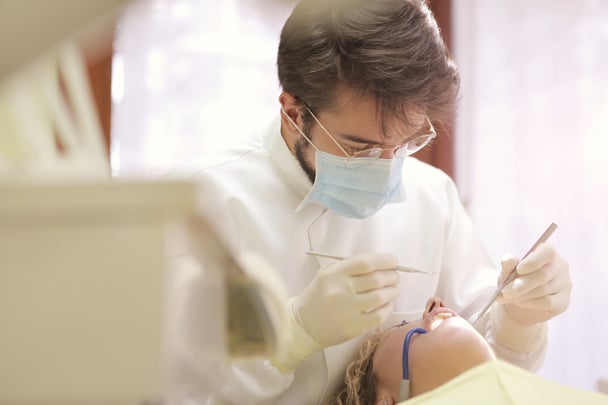 Dentist working on periodontal maintenance for patient